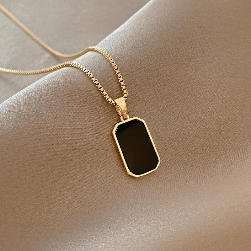 Elegant close-up of Midnight Muse Necklace displayed on a velvet stand