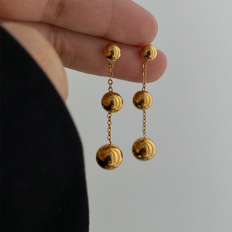 golden orbit earrings in gold finish; stylish golden orbit earrings for women