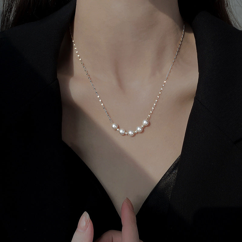 Elegant close-up of Silver-Pearl Grace Necklace displayed on a velvet stand