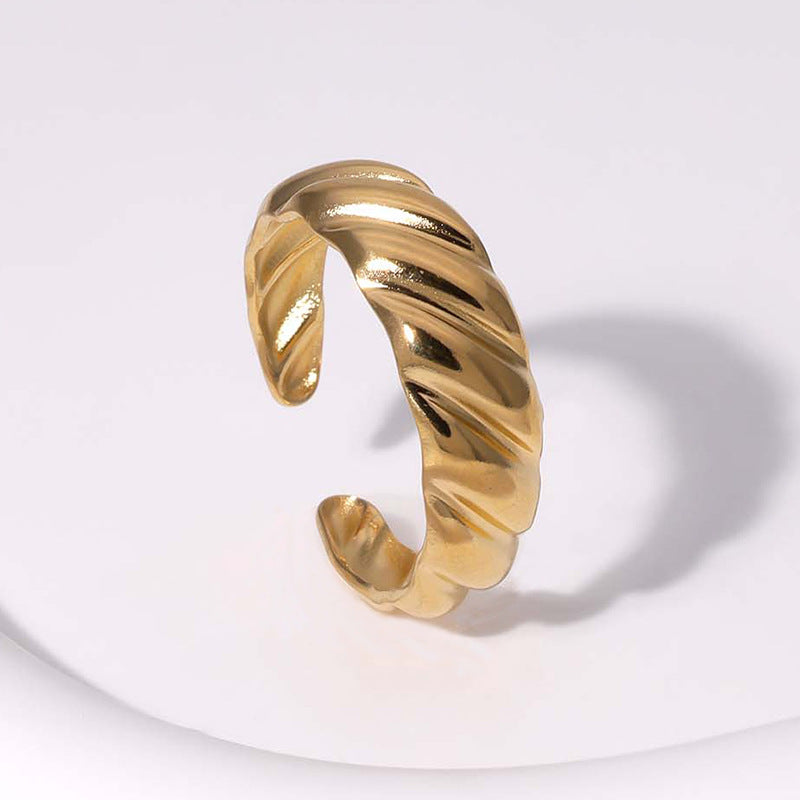 twist glow ring in gold finish; elegant twist glow ring for women