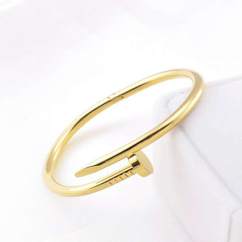 Close-up image of Golden Grip Bracelet on a white background