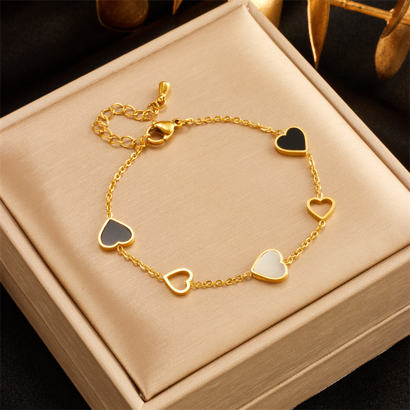 Close-up image of Twin Hearts Bracelet on a white background