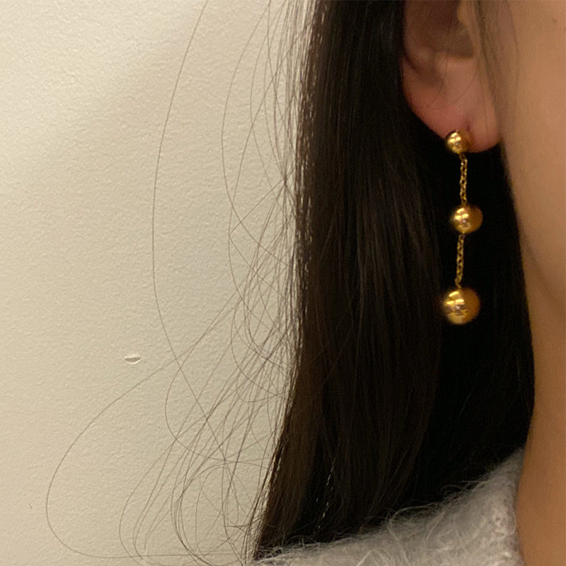 golden orbit earrings in gold finish; stylish golden orbit earrings for women