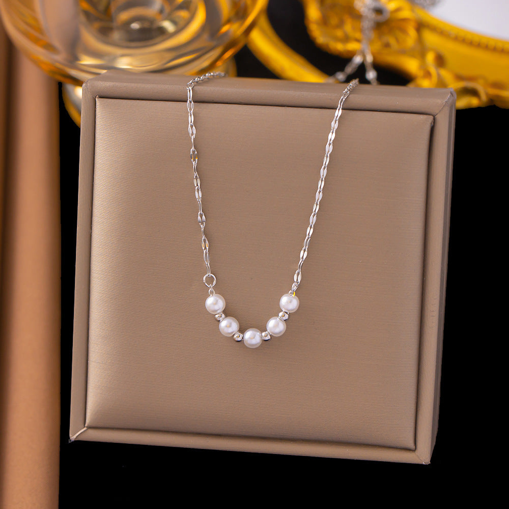 Elegant close-up of Silver-Pearl Grace Necklace displayed on a velvet stand