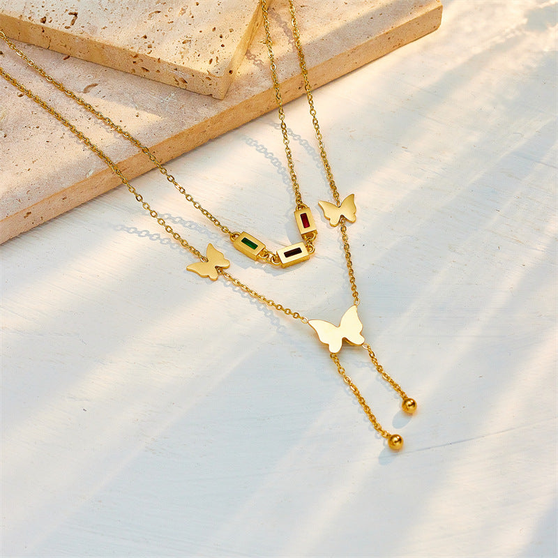 Elegant close-up of Golden Wings Necklace displayed on a velvet stand