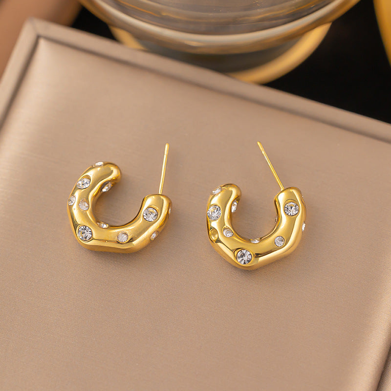 gleam loop earrings in gold finish; stylish gleam loop earrings for women