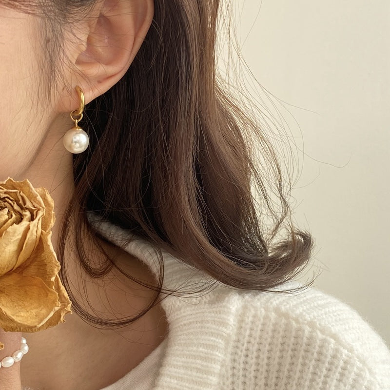 pearl dangles earrings in gold finish; stylish pearl dangles earrings for women