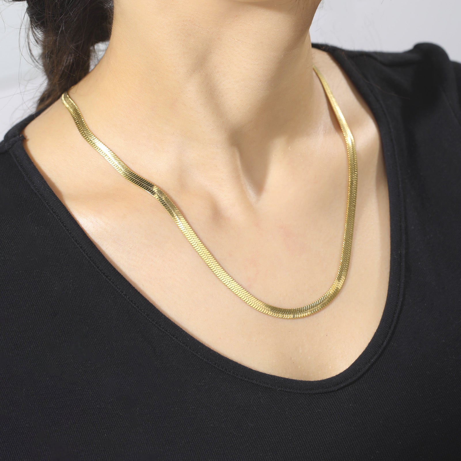 Elegant close-up of Golden Sleek Velvet Necklace displayed on a velvet stand
