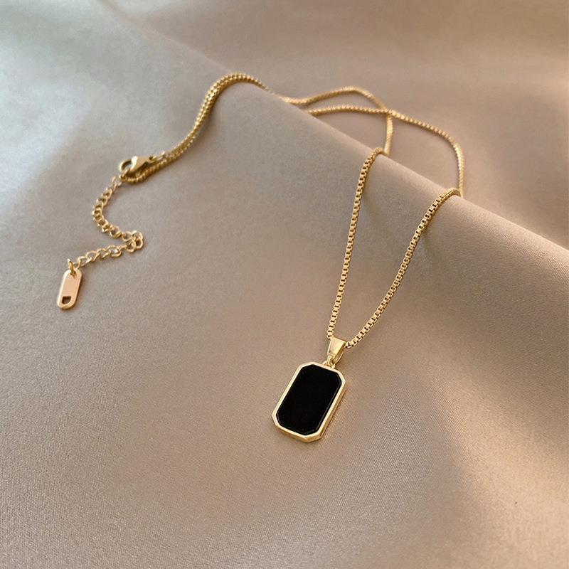 Elegant close-up of Midnight Muse Necklace displayed on a velvet stand