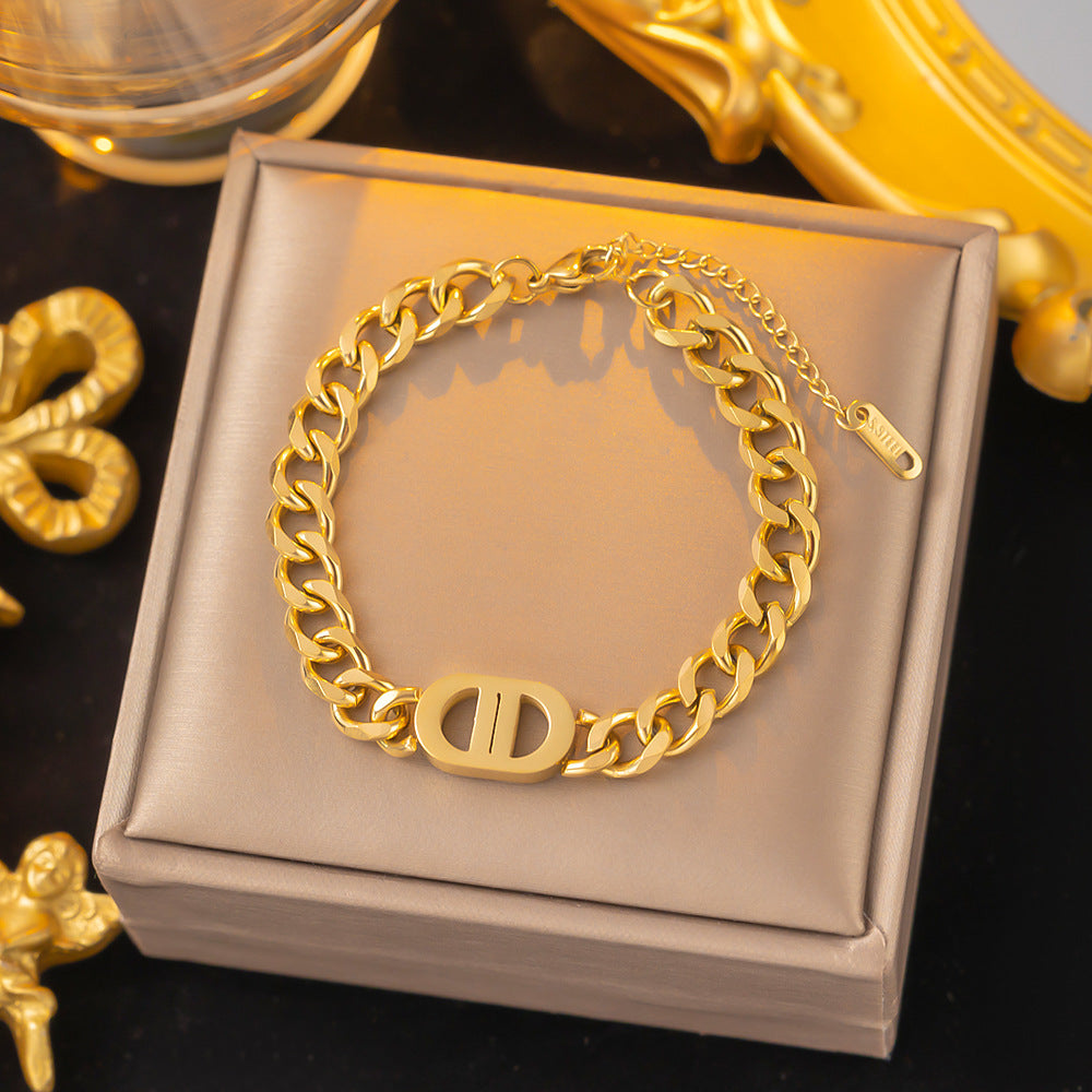 Close-up image of Auralin Emblem Bracelet on a white background