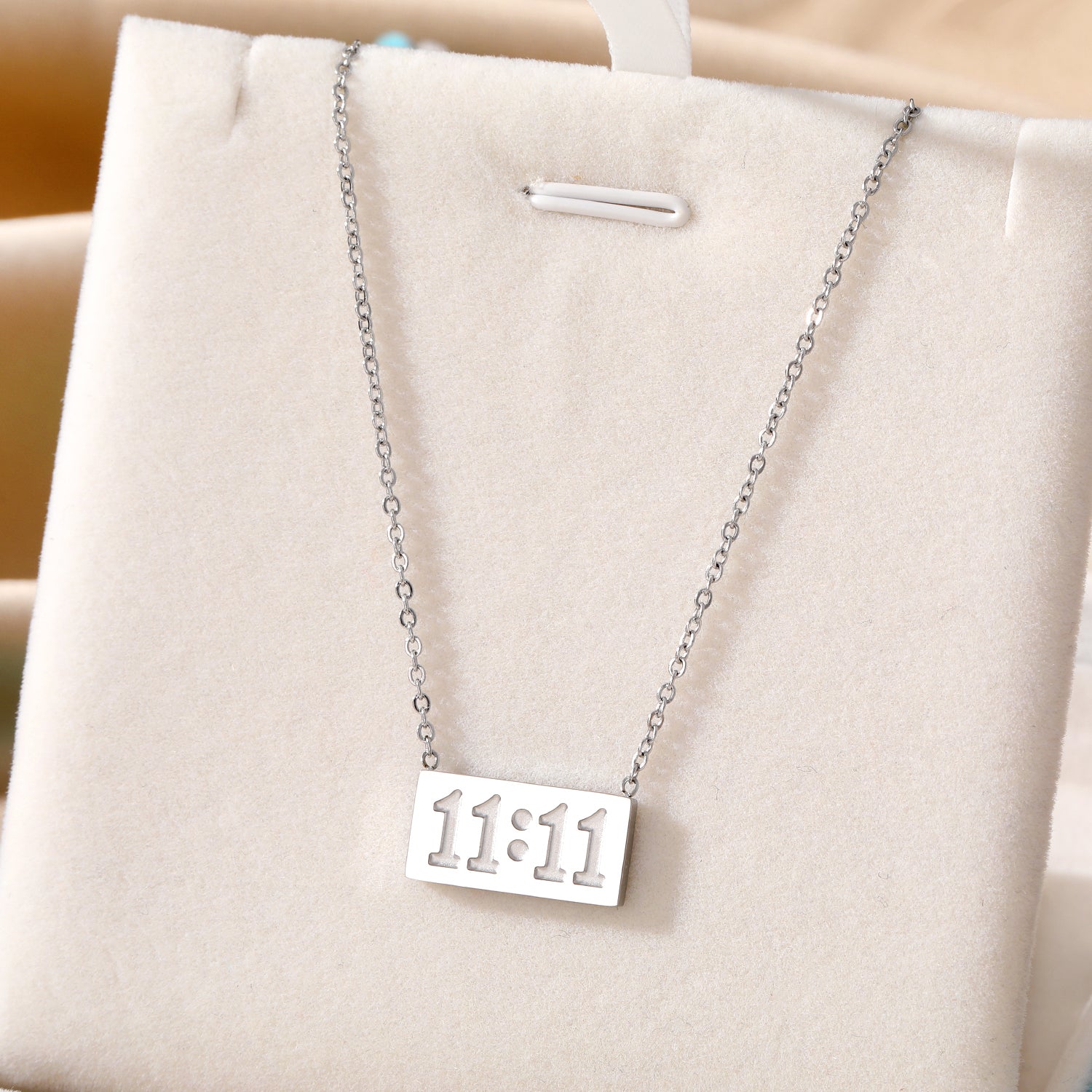 Elegant close-up of Moment Eleven Eleven displayed on a velvet stand