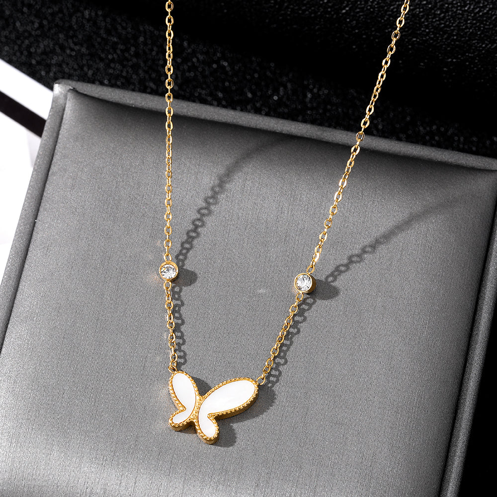 Elegant close-up of Butterfly Gleam Necklace displayed on a velvet stand