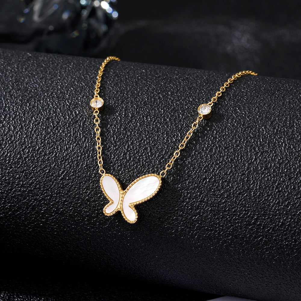Elegant close-up of Butterfly Gleam Necklace displayed on a velvet stand