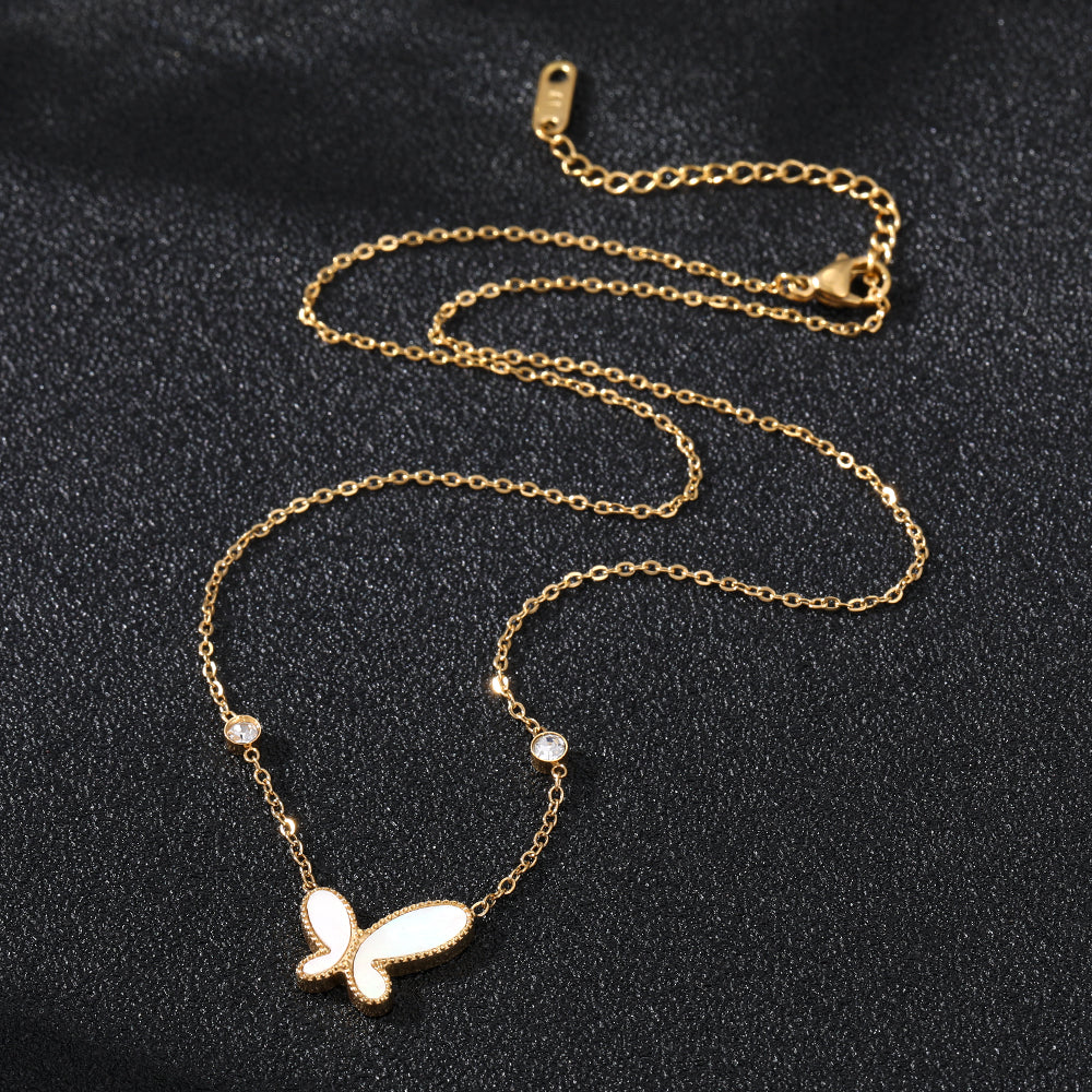 Elegant close-up of Butterfly Gleam Necklace displayed on a velvet stand