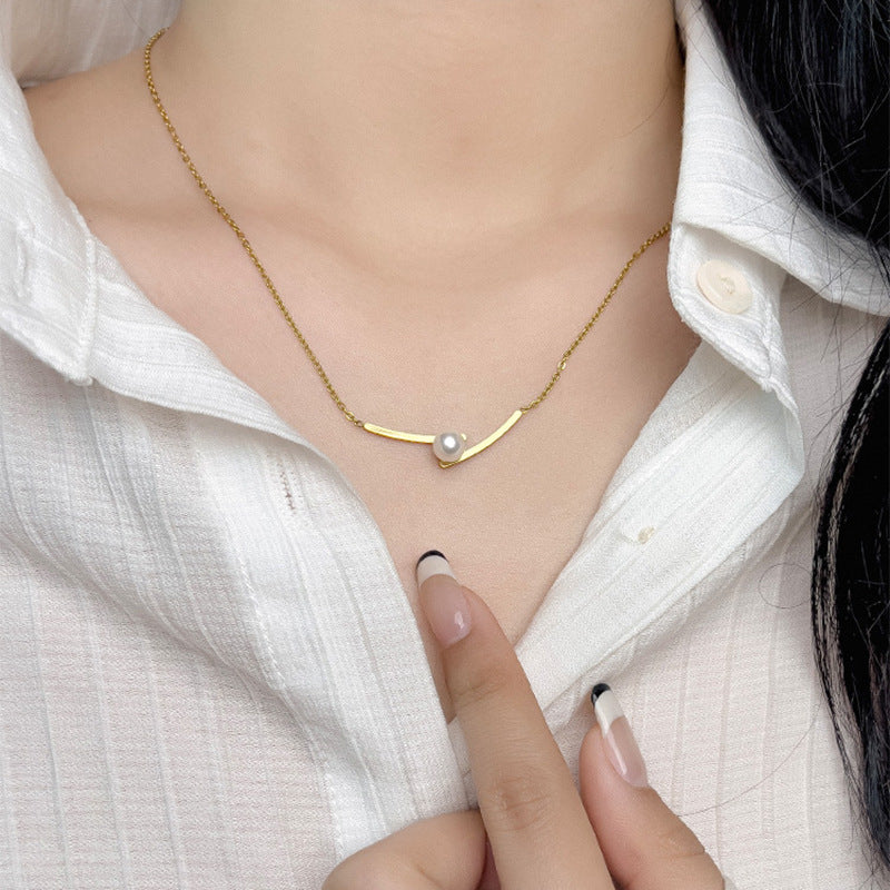 Elegant close-up of Opal Curve Necklace displayed on a velvet stand