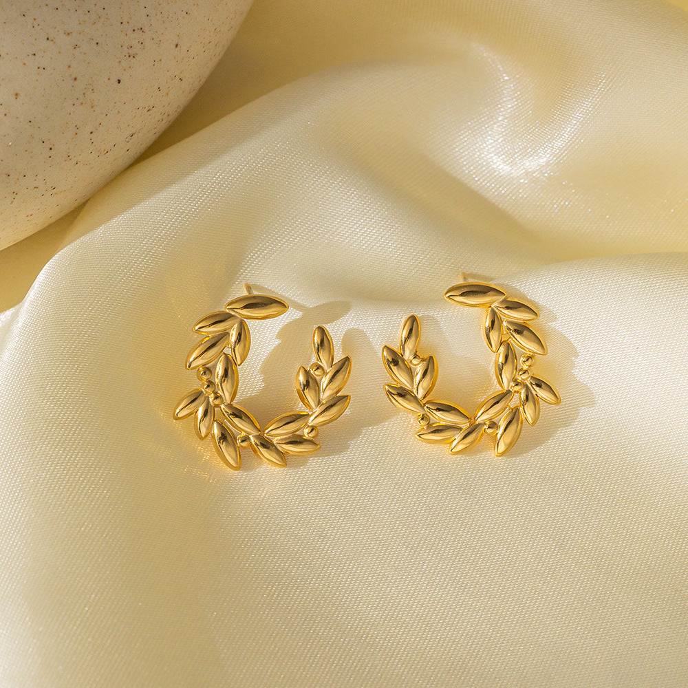 crown leaf earrings in gold finish; stylish crown leaf earrings for women