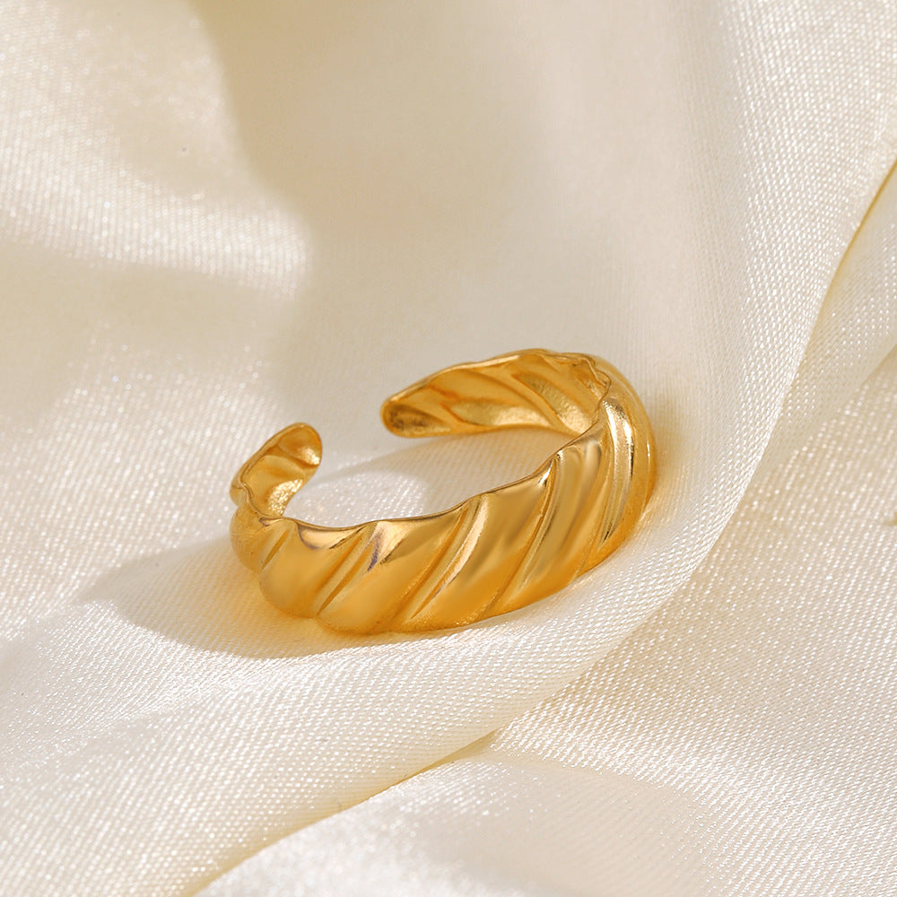 twist glow ring in gold finish; elegant twist glow ring for women