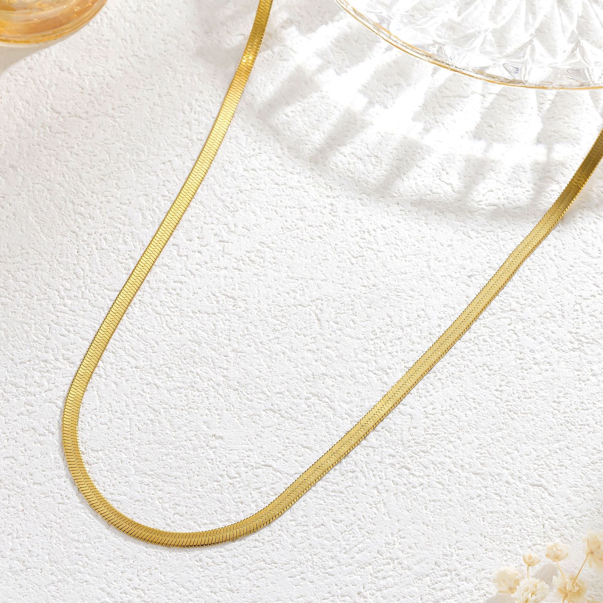 Elegant close-up of Golden Sleek Velvet Necklace displayed on a velvet stand
