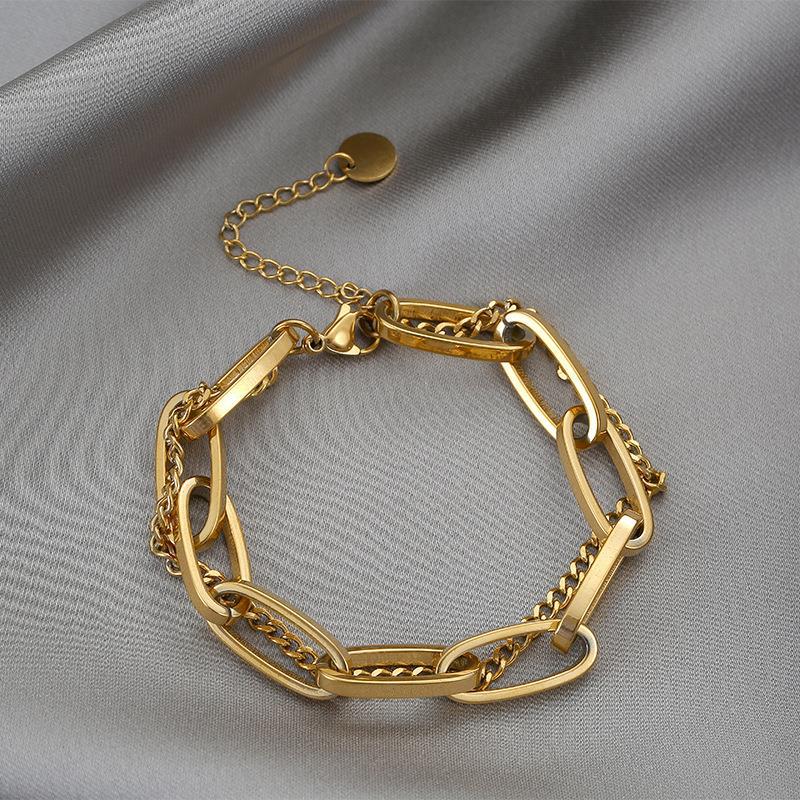 Close-up image of Auralin Emblem Bracelet on a white background