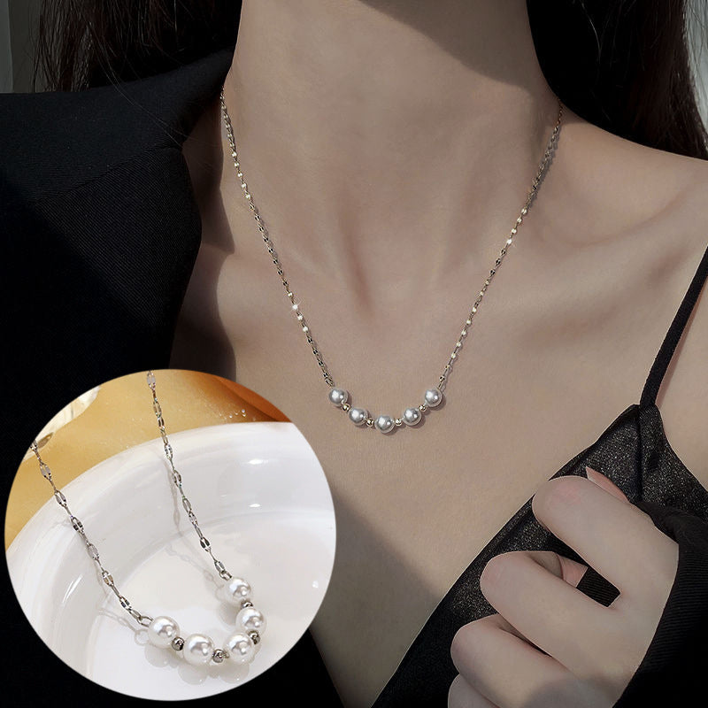 Elegant close-up of Silver-Pearl Grace Necklace displayed on a velvet stand
