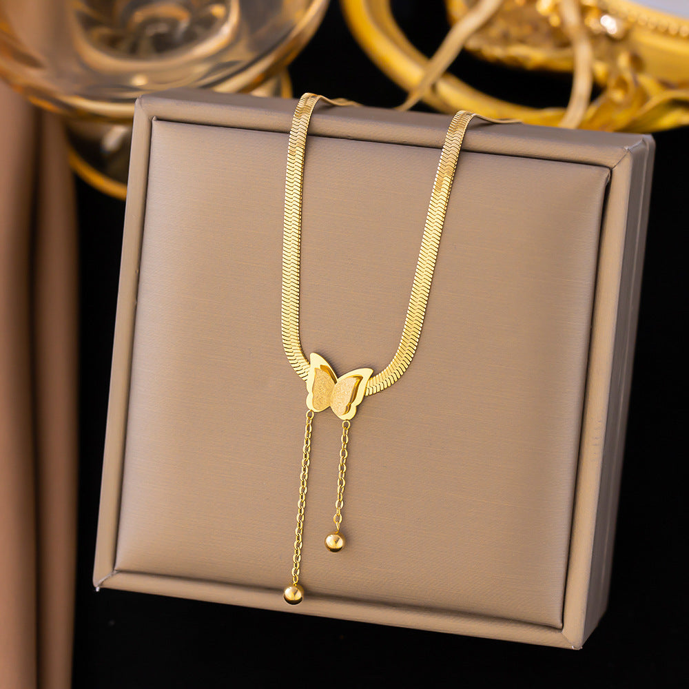 Elegant close-up of Butterglow Necklace displayed on a velvet stand
