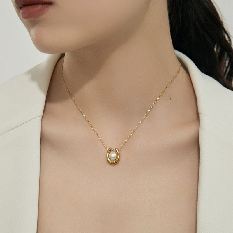Elegant close-up of Pearl Haven Necklace displayed on a velvet stand