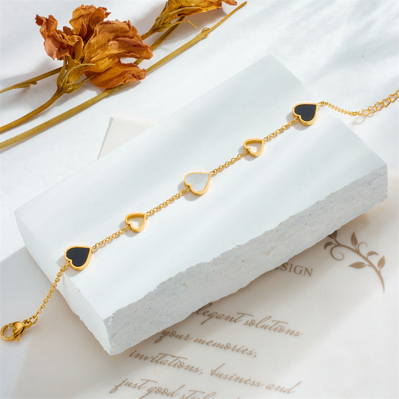Close-up image of Twin Hearts Bracelet on a white background