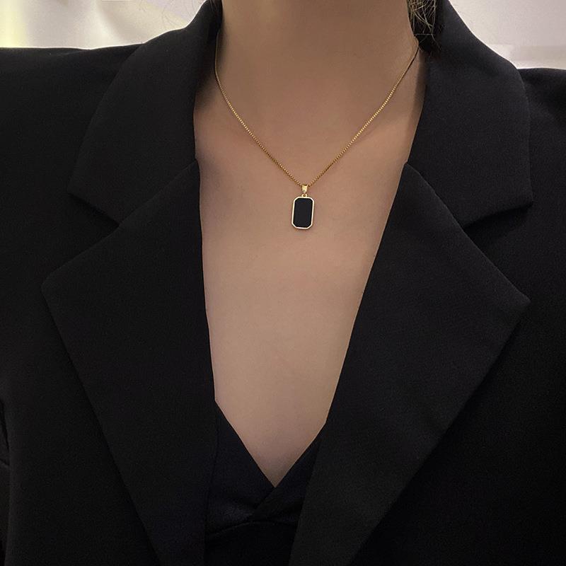 Elegant close-up of Midnight Muse Necklace displayed on a velvet stand