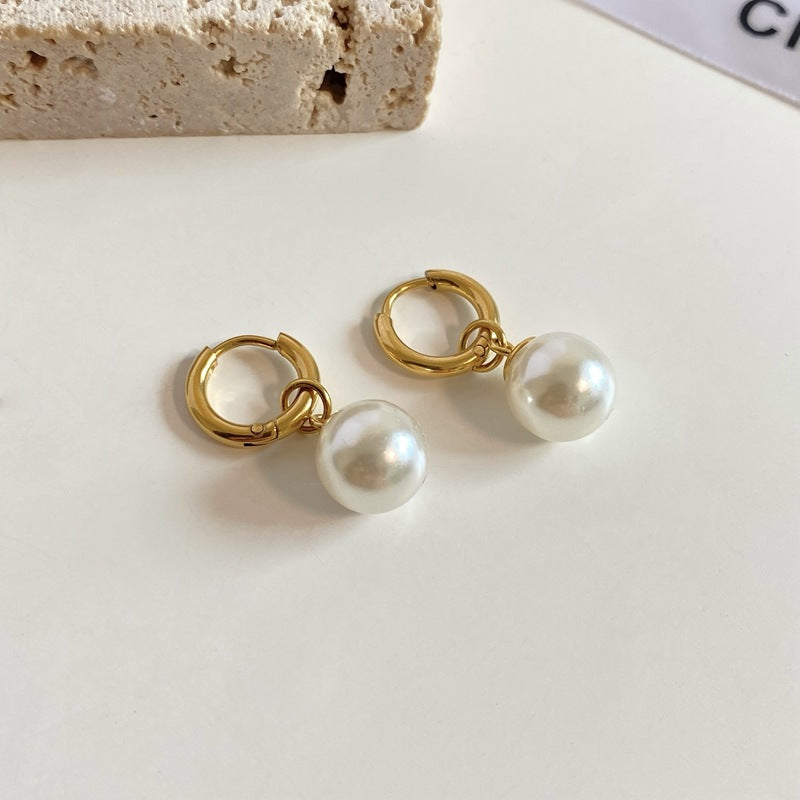 pearl dangles earrings in gold finish; stylish pearl dangles earrings for women