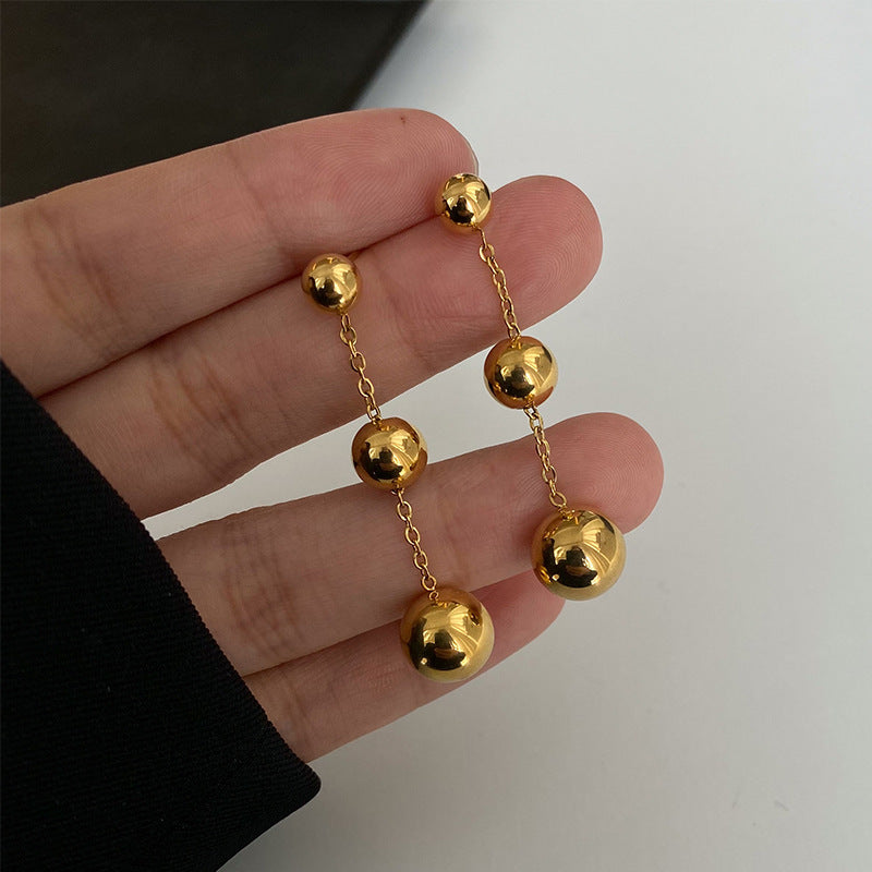 golden orbit earrings in gold finish; stylish golden orbit earrings for women