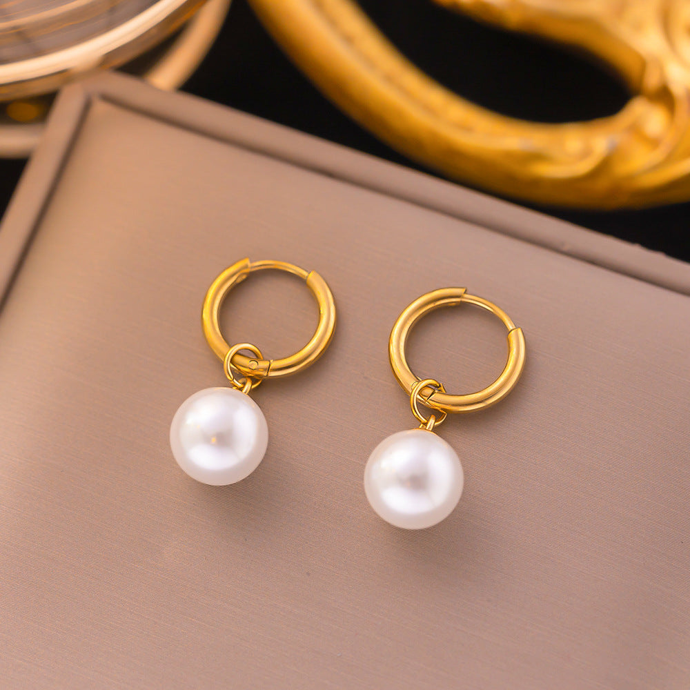 pearl dangles earrings in gold finish; stylish pearl dangles earrings for women