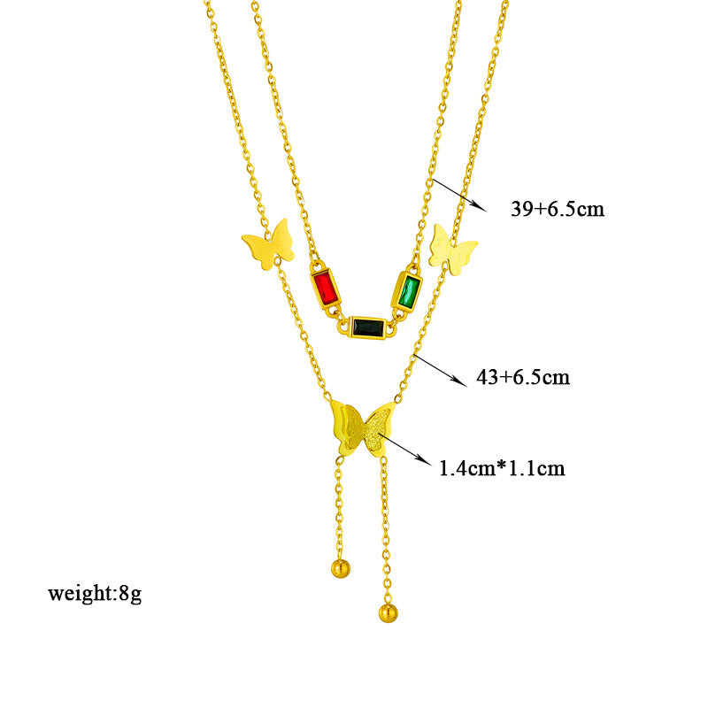 Elegant close-up of Golden Wings Necklace displayed on a velvet stand
