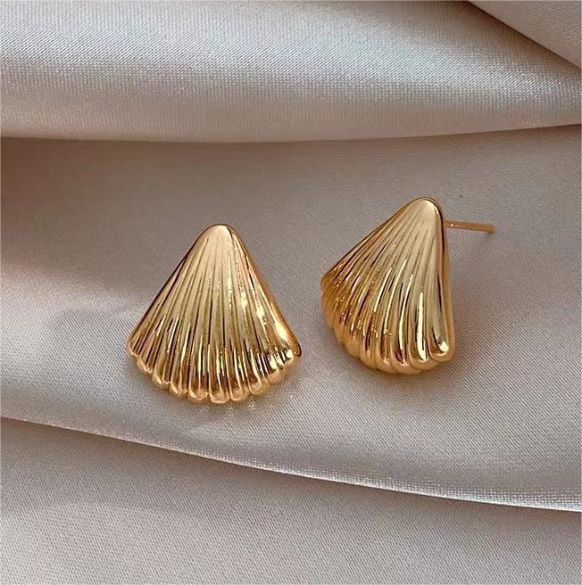 shell gleam earrings in gold finish; stylish shell gleam earrings for women