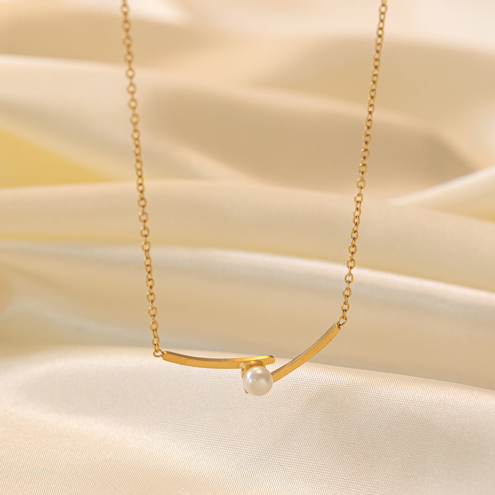 Elegant close-up of Opal Curve Necklace displayed on a velvet stand