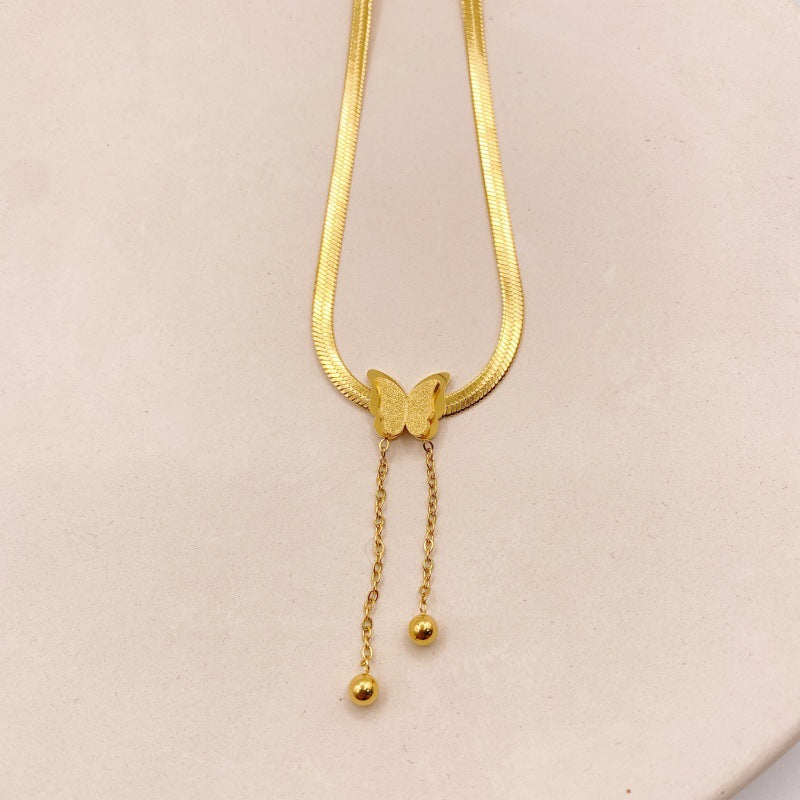 Elegant close-up of Butterglow Necklace displayed on a velvet stand