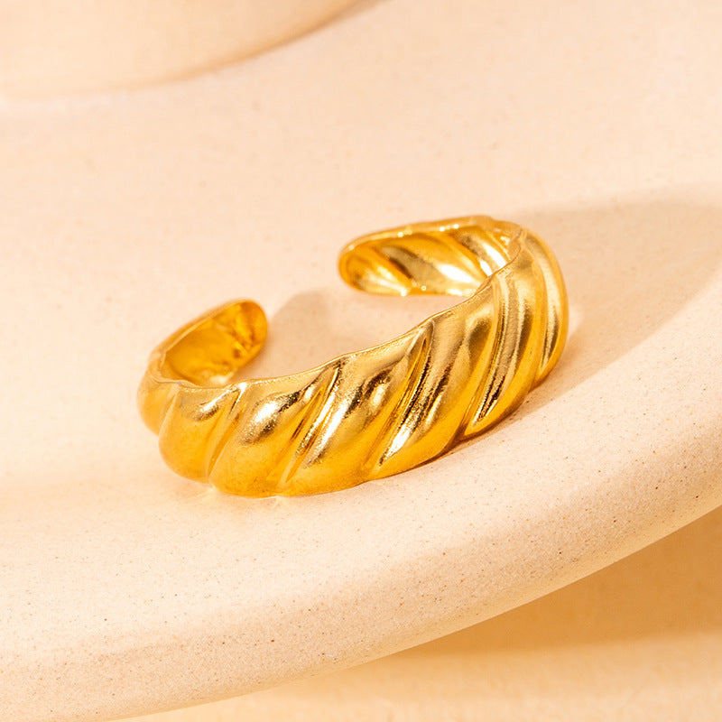 twist glow ring in gold finish; elegant twist glow ring for women