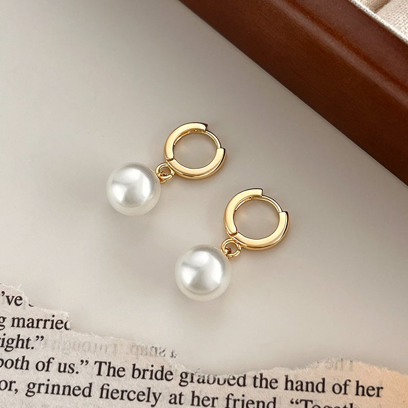 pearl dangles earrings in gold finish; stylish pearl dangles earrings for women