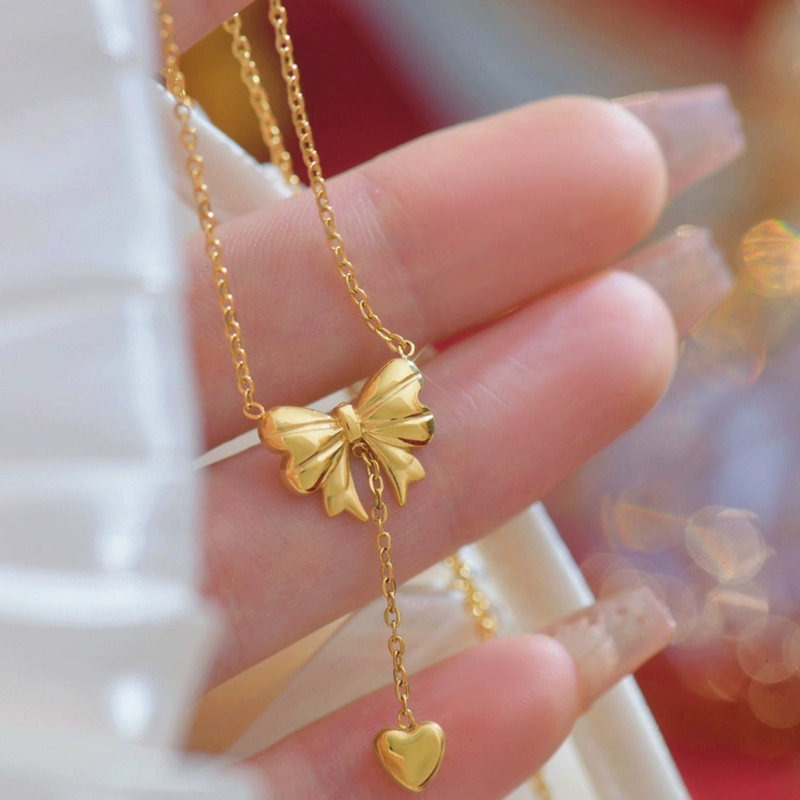 Elegant close-up of Golden Grace Sweetheart Necklace displayed on a velvet stand