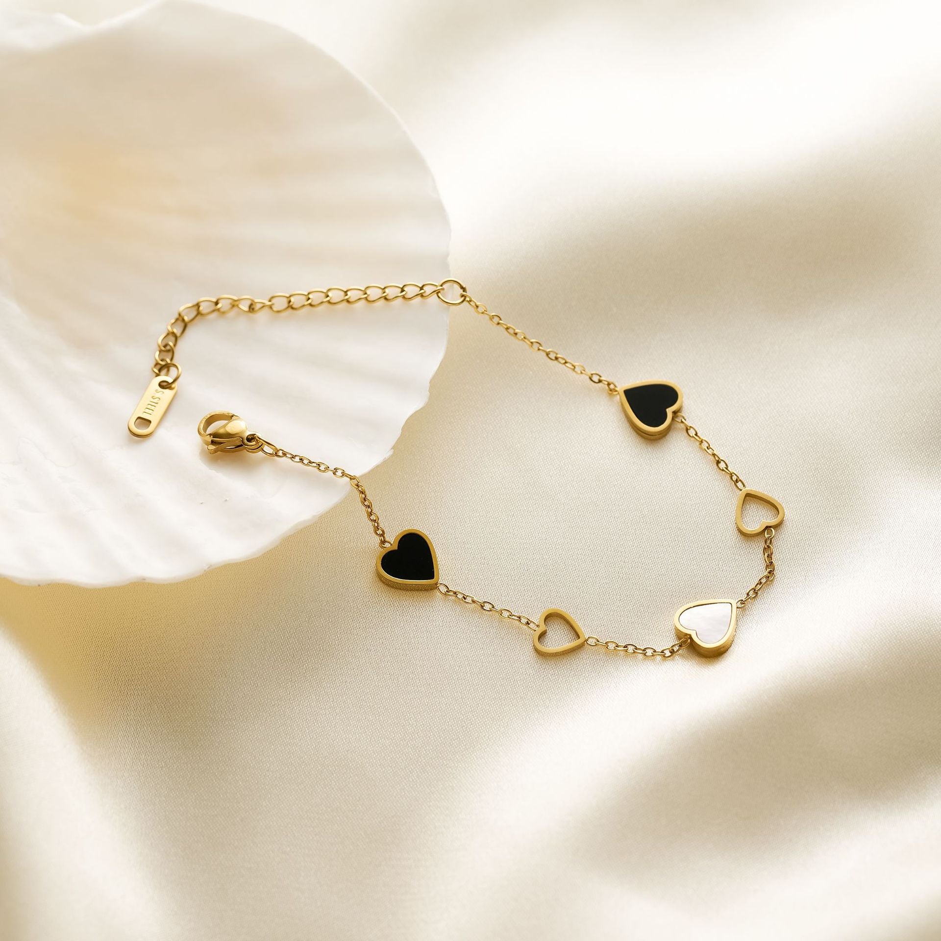 Close-up image of Twin Hearts Bracelet on a white background