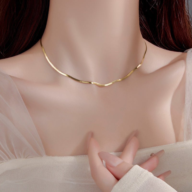 Elegant close-up of Golden Sleek Velvet Necklace displayed on a velvet stand
