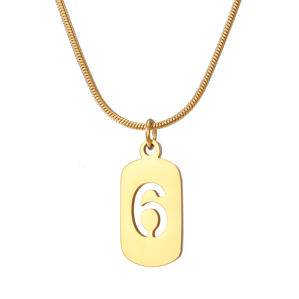 Elegant close-up of Golden Six Necklace displayed on a velvet stand