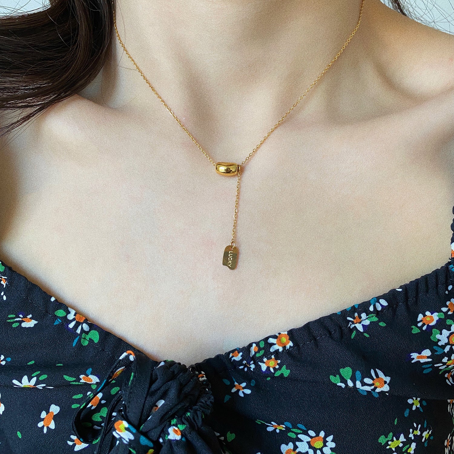 Elegant close-up of Luxe Line Necklace displayed on a velvet stand