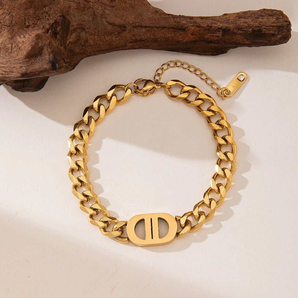 Close-up image of Auralin Emblem Bracelet on a white background