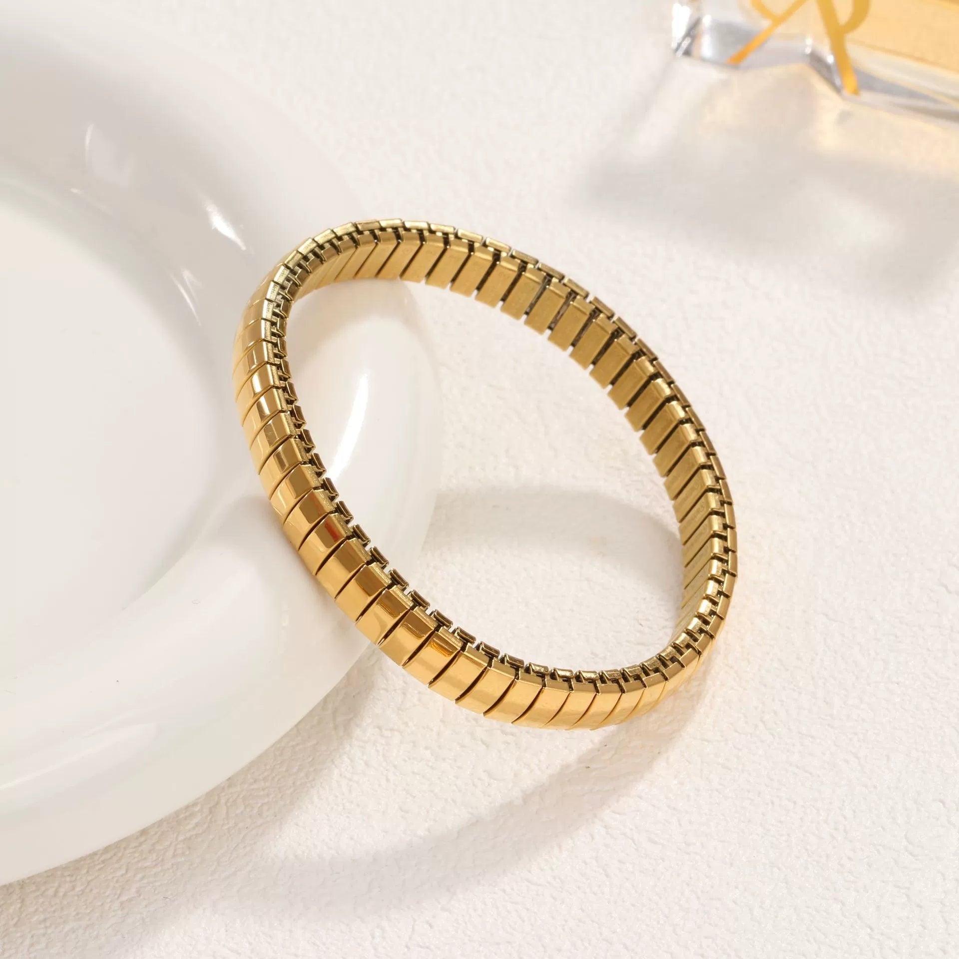 Close-up image of Gold Wrap Bracelet on a white background