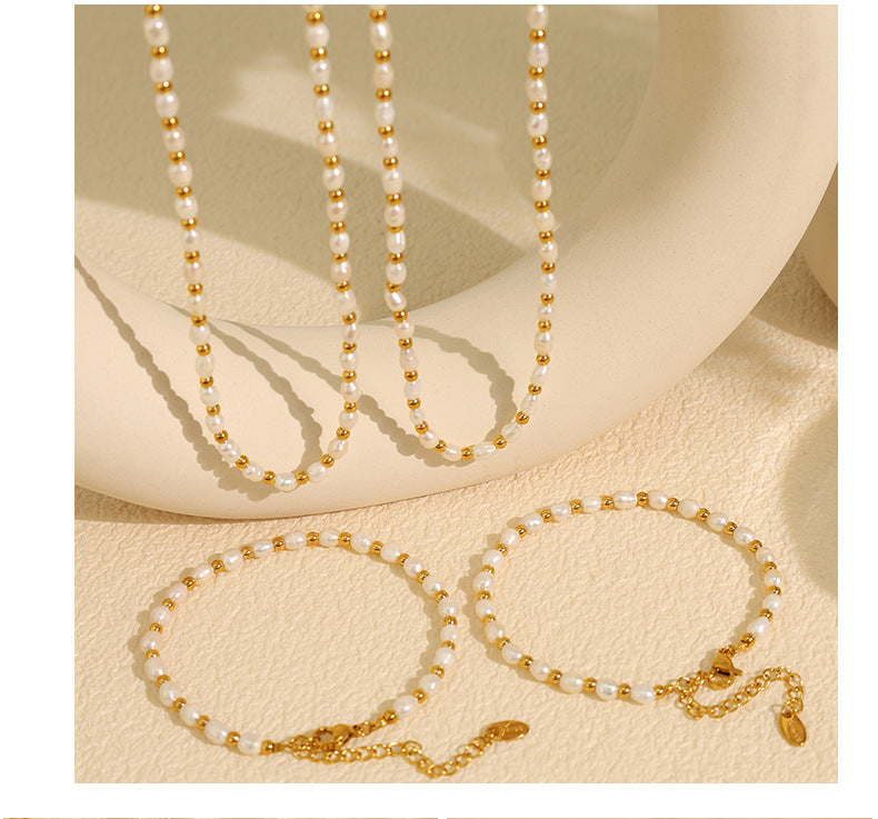 Elegant close-up of Celene Gold-Pearl Necklace displayed on a velvet stand