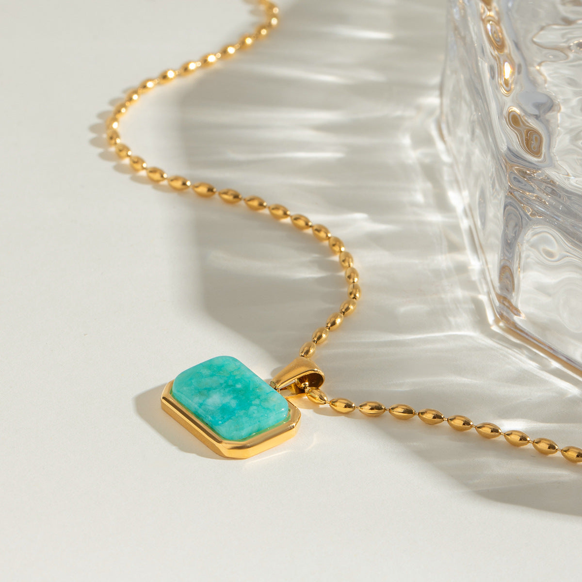 Elegant close-up of Oceanstone Necklace displayed on a velvet stand