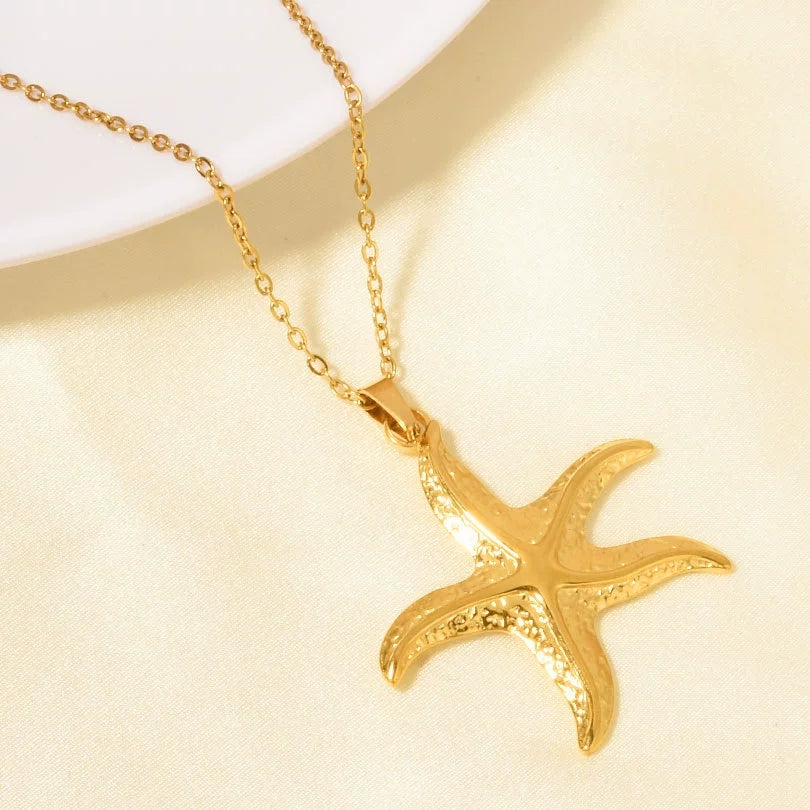 Elegant close-up of Ocean Bloom Necklace displayed on a velvet stand
