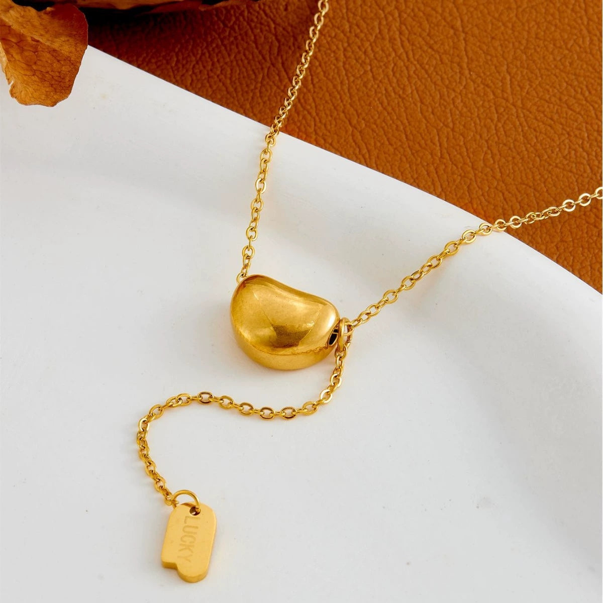 Elegant close-up of Luxe Line Necklace displayed on a velvet stand