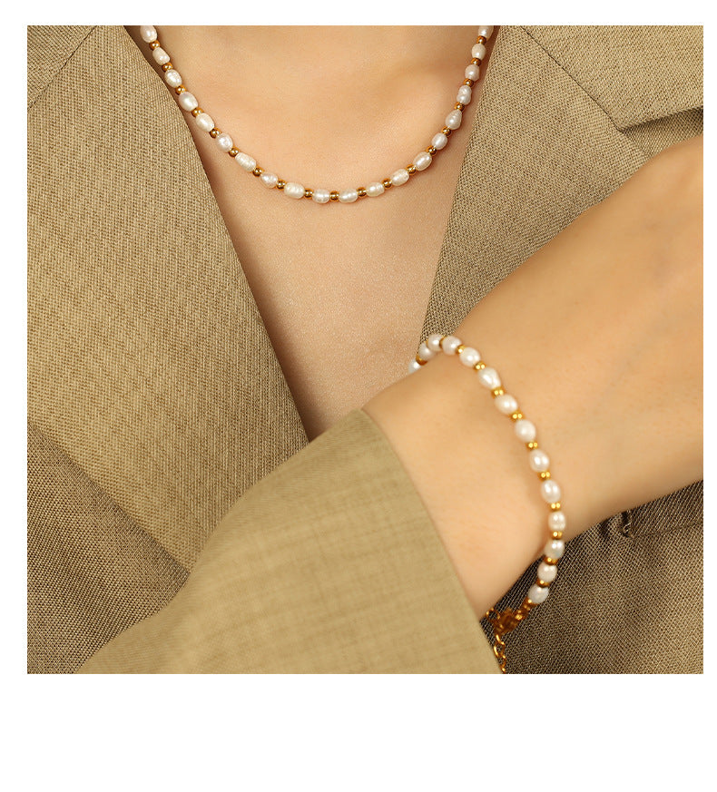 Elegant close-up of Celene Gold-Pearl Necklace displayed on a velvet stand