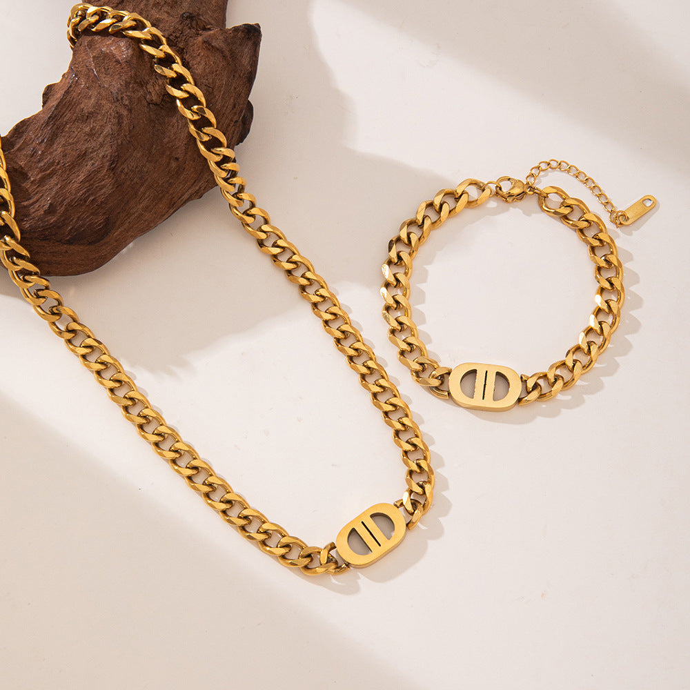 Elegant close-up of Auralin Emblem Chain displayed on a velvet stand